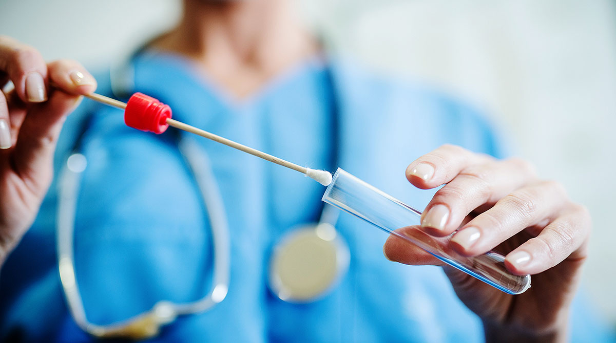a test kit is held by a person